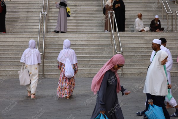 Mecca, Saudi Arabia - March 12 2025: people buying products from market shop in Mecca close to Masjid al-Haram, pilgrims umrah shopping in Makkah