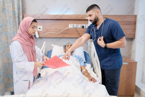 Saudi female doctor and paramedic in medical uniform and examining and applying nutritional solution, medicine and health care