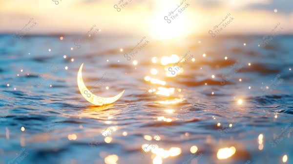 An image of a sea illuminated by golden sunlight at sunset. A reflective crescent moon appears on the water\'s surface, surrounded by visual effects resembling sparkling stars. The horizon in the background meets a sky lit by the warm glow of the sun.