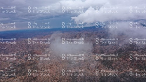 Clouds cover the rocky tops of the Sarawat Mountains in Saudi Arabia