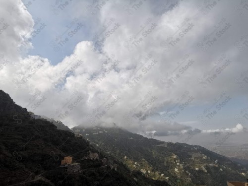 A phone shot showing a group of houses and forests showing Sahab embracing her in the Fayfa governorate in the Jazan region in southern Saudi Arabia.