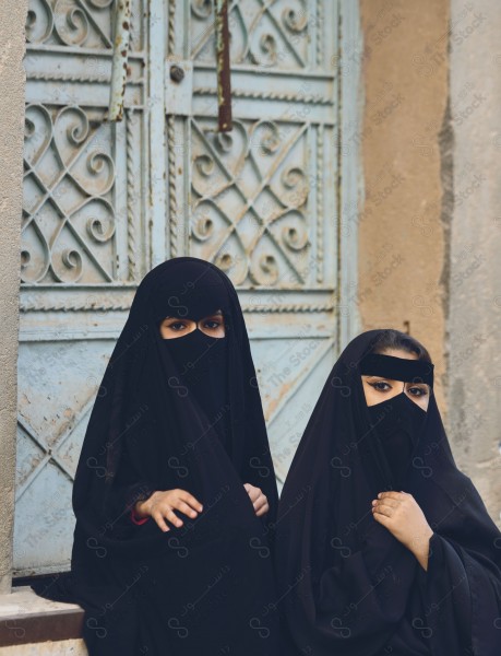 A shot of a two Saudis woman wearing the traditional Saudi dress Folklore, foundation day, represents the Saudi culture