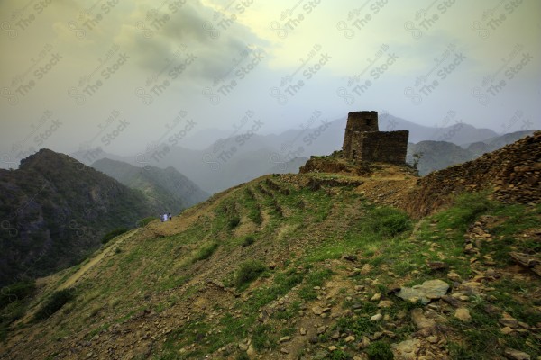 A snapshot of a series of mountains and green areas in Fifa, southern Saudi Arabia, houses on mountain heights, nature in Saudi Arabia