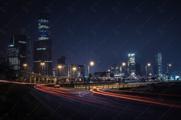 A snapshot of the towers of the financial center in Riyadh, using slow exposure at night, showing a clear sky, towers, skyscrapers, buildings and landmarks