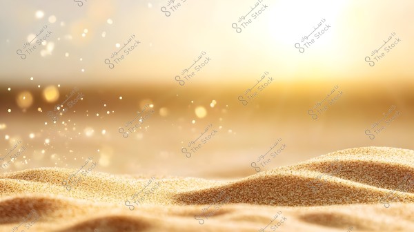 An image depicting a natural desert landscape focusing on sparkling sand under bright sunlight. The horizon is tinged with golden-yellow, and the sunlight illuminates the sand dunes in the foreground.