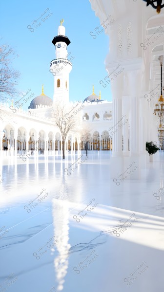 An image of a large and beautiful mosque courtyard, perfectly lit by natural light with reflections of columns and shiny tiles. A white minaret stands in the center, adorned with golden elements and a crescent. The background includes ornate domes and Islamic architectural details.