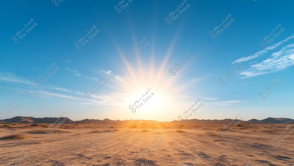 The image shows a beautiful sunset or sunrise scene in the desert. The sun illuminates the sky with its bright rays spreading in all directions, accompanied by light clouds. In the horizon, stretching sand dunes can be seen, adding to the beauty of the vast desert landscape.