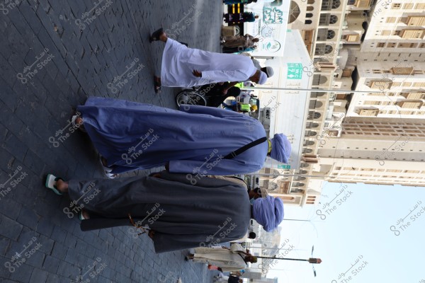 Mecca, Saudi Arabia - March 12 2025: people buying products from market shop in Mecca close to Masjid al-Haram, pilgrims umrah shopping in Makkah
