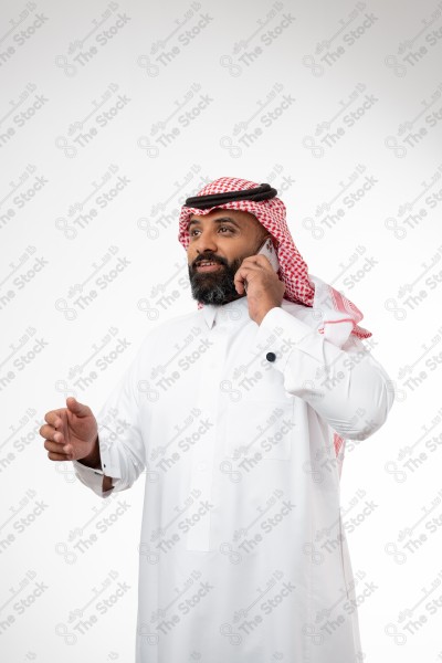 Portrait of a Saudi man holding a phone and making a phone call with different expressions