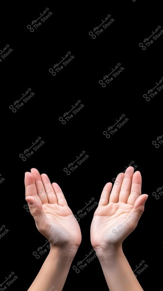 An image of two open hands facing upwards in a praying position on a black background. The skin of the hands is clearly visible with details of the fingers and palm.