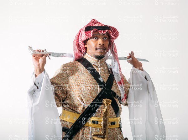 A man wearing the Saudi costume for the najdi traditional dance