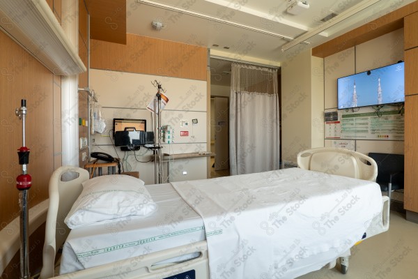 An image of a hospital that includes a group of patient beds, which reflects the medical environment equipped to care for patients and provide the necessary health support