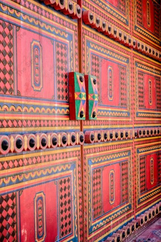 Wooden Antique door built into mud wall - Old traditional wooden door in Saudi Arabia