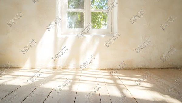 The image shows a large white window allowing sunlight to stream in, casting light and shadows on the light-colored wooden floor. The walls are warm-toned with a smooth appearance, creating a serene and warm atmosphere in the room.