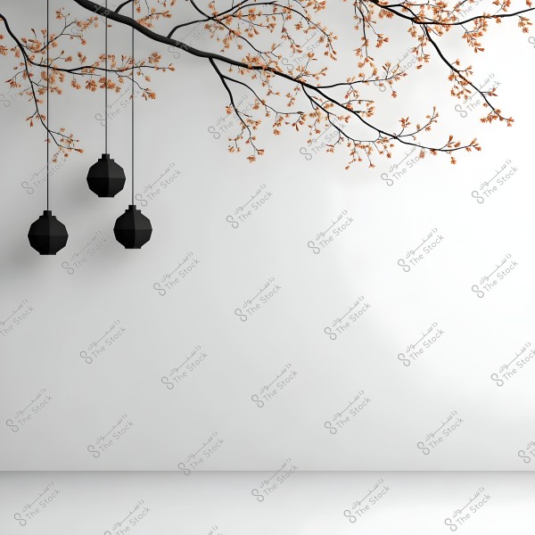 An image shows a smooth white wall with delicate brown-leafed tree branches extending across the top. Three geometrically shaped black lamps hang from the branches, adding an artistic and minimalist decorative element to the scene.