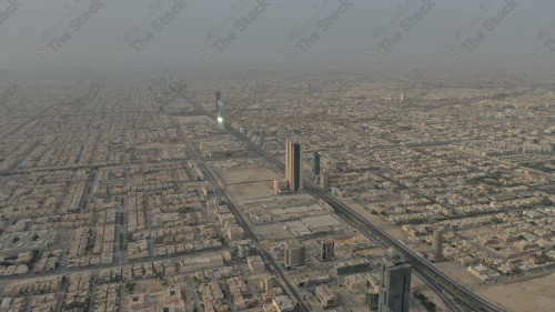 An aerial view of the capital, Riyadh, showing cloudy sky during the day, the towers in the city of Riyadh