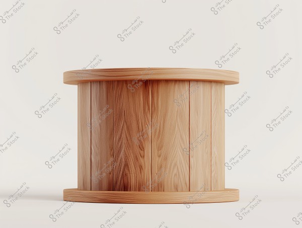 An image showing a cylindrical object made of light-colored wood, featuring a simple and smooth design, placed on a white background. The wood displays natural grain patterns and the cylinder is topped and bottomed by circular bases.