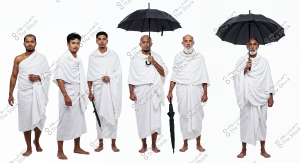 An image of six men standing side by side, wearing white ihram clothing used for Hajj and Umrah. Two of them are holding open black umbrellas. The men appear to be from diverse Islamic countries and are clearly positioned against a pristine white background.