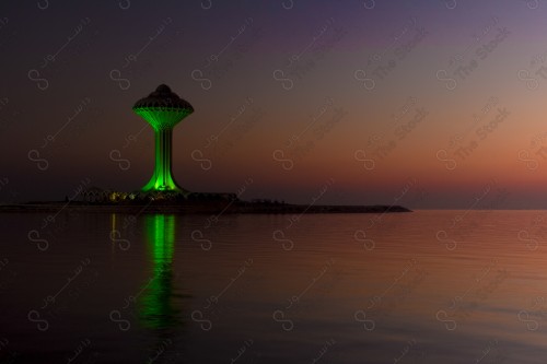 A shot of the water tower in the city of Khobar and the sky is clear at sunset.