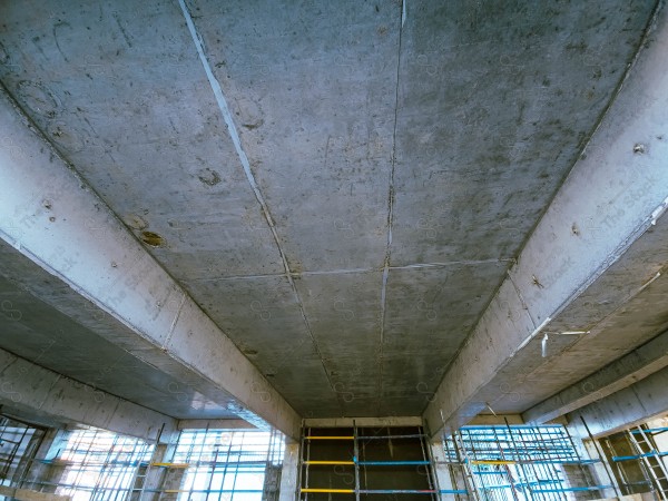 A construction site with a large building in the background. multi-storey building. A construction site with scaffolding and a large building in the background.