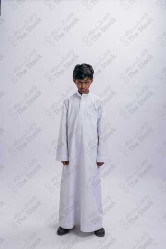 Portrait of a Saudi child on a white background , souvenir photos, ، documenting a happy moment, Eid candy, Eid gifts, Eidiyat, incense