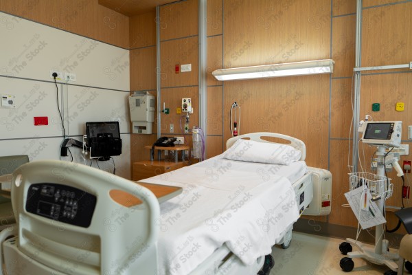 An image of a hospital that includes a group of patient beds, which reflects the medical environment equipped to care for patients and provide the necessary health support