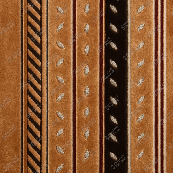 An image of a decorative pattern consisting of vertical stripes in shades of brown, black, and beige. The design features repeating slanted leaf motifs, with one stripe showcasing a slanted pattern. The design creates a sense of harmony and repetition.