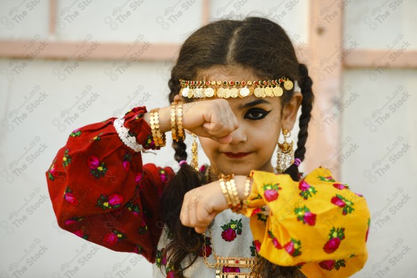 A shot of a Saudi girl wearing the traditional Saudi dress that represents the folklore, foundation day, and Saudi culture