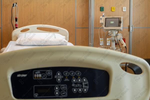 An image of a hospital that includes a group of patient beds, which reflects the medical environment equipped to care for patients and provide the necessary health support