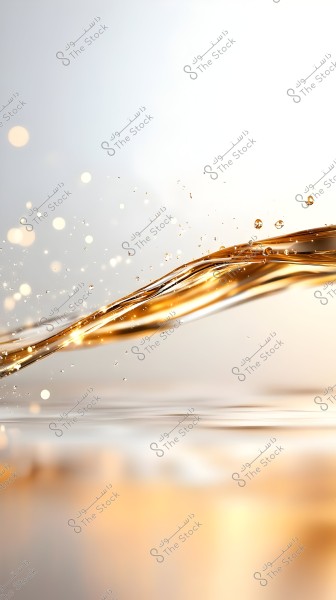 The image shows a flow of a shiny golden liquid resembling oil or honey smoothly streaming with a blurred background featuring gradients of white and gold. Small light particles scattered across the image give a sense of sparkle and movement.