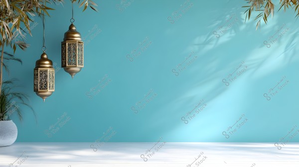 An image showing two traditional lanterns hanging against a light blue background. The lanterns are made of metal with ornate designs resembling Arabic style. Shadows of green plants are visible on the blue wall, and a white wooden floor with a pot containing a plant is on the left.