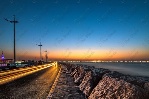 An aesthetic snapshot of Al Marjan Island, showing the lake and the road with car traffic, tourism in Saudi Arabia.