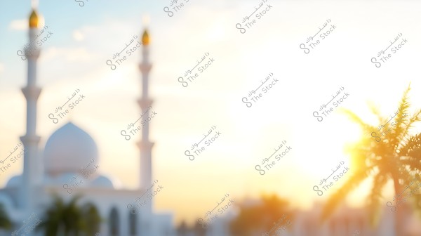 Image of a blurred scene of a mosque with Islamic architectural design featuring two minarets and domes, with the sun rising in the background. A palm tree is partially visible on the right side of the frame.