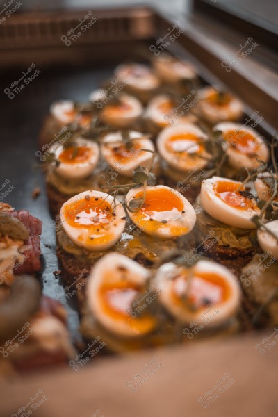 Soft-boiled eggs served on toast with herbs and spices.