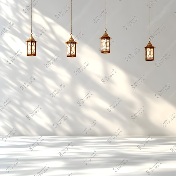 An image of four hanging lanterns suspended from the ceiling against a white background. The lanterns emit warm light, casting overlapping natural shadows on the wall and floor, creating an artistic, simple, and soothing scene.
