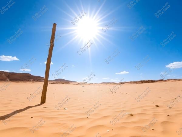 An image of a vast desert under a clear blue sky with a bright sun at the center. A wooden post stands in the golden sand in the foreground. Low rocky hills and scattered white clouds are visible on the horizon.