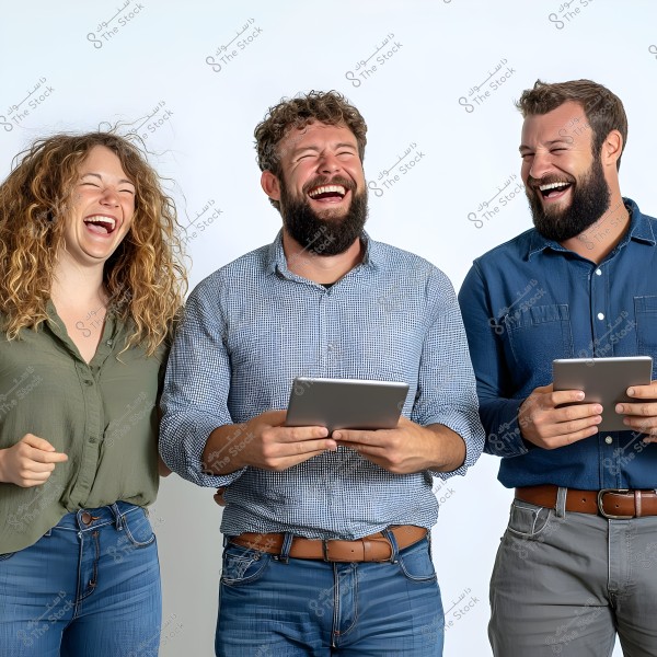 Three people laughing while standing side by side holding tablets. The woman on the left is wearing a green shirt and jeans, with long curly hair. The man in the middle is wearing a checkered blue shirt and jeans, holding a tablet. The man on the right is in a dark blue shirt and gray pants, also holding a tablet. They are all laughing and appear to be enjoying themselves.