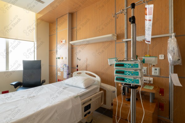 An image of a hospital that includes a group of patient beds, which reflects the medical environment equipped to care for patients and provide the necessary health support