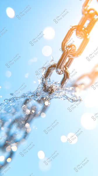 A tight metal chain is visible in the image, covered with splashes of water. Sunlight reflects off the chains, giving them a shiny appearance. The background is blue with bright bokeh light spots, creating a sense of freshness and clarity.