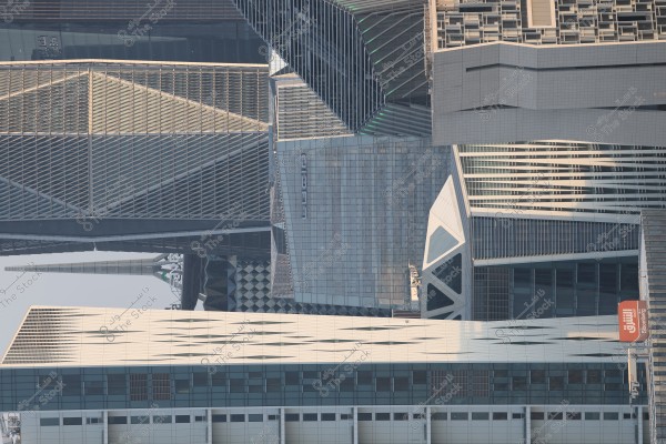 An image of a cluster of modern skyscrapers with distinctive architectural designs in Riyadh, Saudi Arabia. The image includes several buildings with glass and metallic structures, as well as buildings with innovative geometric facades.