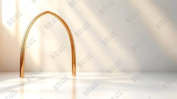The image features a golden arch placed centrally in a simple and elegant composition. The arch is made of a shiny metal and stands on a smooth white surface, with a soft background featuring warm color gradients and gentle shadows. The lighting is natural, flowing through an invisible window, adding an aesthetic dimension to the scene.