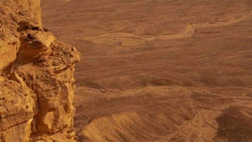 A shot of a rocky mountain chain at sunset, of the Tuwaiq mountain range in the Najd region