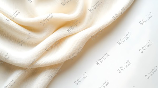 An image of a sheer fabric in a creamy white color, displayed in a natural, wavy pattern. The lighting highlights the soft texture and the visible folds of the fabric.