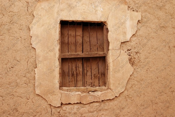 Close-up of a wooden window of a mud house, ancient buildings, mud houses.