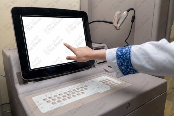 A shot of a female doctor using the device to fill out data.