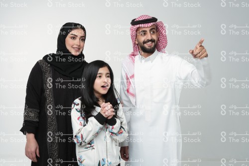 Saudi family making gestures