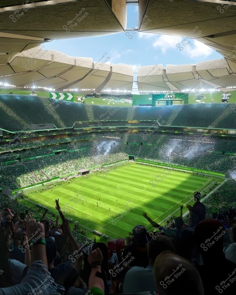 A modern football stadium filled with cheering fans. The field is covered with lush green grass and surrounded by packed stands of spectators waving and cheering. The roof is open, allowing sunlight to penetrate inside. Digital banners and screens display match information in green colors. The sky is clear, indicating a sunny day.