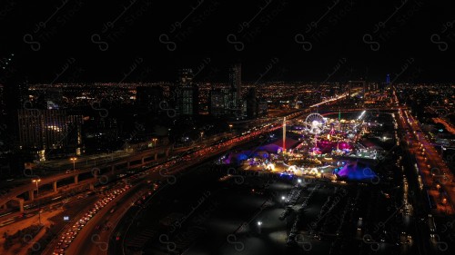 A shot showing the buildings and landmarks of the King Abdullah Financial District in the city of Riyadh, in front of it a group of residential houses with traffic.