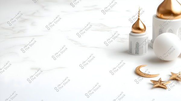 An image of Ramadan decorations featuring models of mosque domes in white and gold on a light marble background. Next to the domes, there is a small white sphere, a crescent moon, and two golden stars.