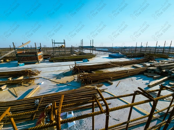 A construction site with a large building in the background. multi-storey building. A construction site with scaffolding and a large building in the background.